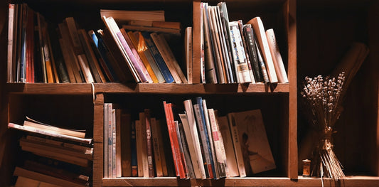books on brown wooden shelf